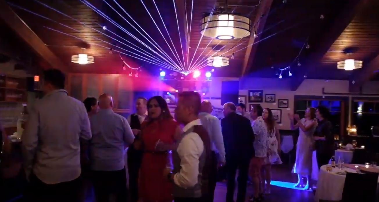 DJ Chris Poynter revs up the crowd with hot beams